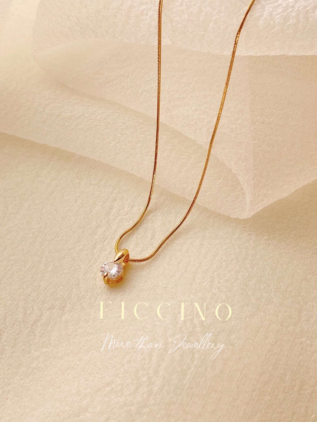 Collar Ficcino con piedra de circonio en titanio y baño de oro 18k